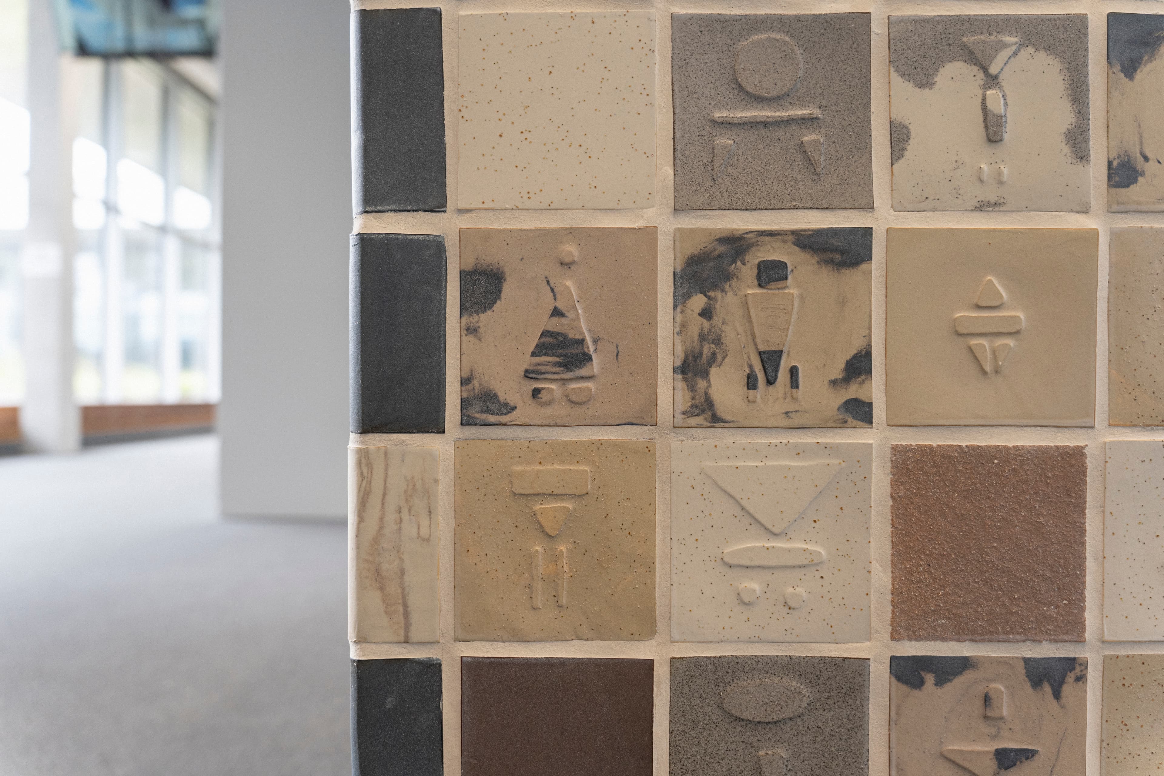 Detail image of tiles with BODIE:S relief